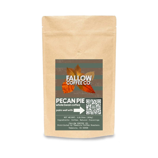 A stand-up kraft paper pouch of Fallow Coffee Co. Pecan Pie whole bean coffee, featuring a dark green label with autumn leaves and a QR code on a white background.